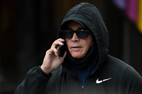 Curtis Warren on a phone call outside a courthouse.