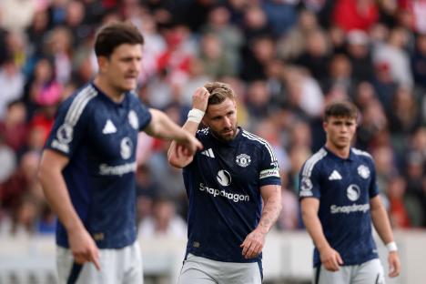 Luke Shaw of Manchester United reacts during a soccer match.
