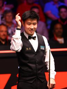 Xintong Zhao reacting during a snooker match.