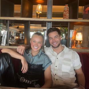 Photo of two people sitting together.