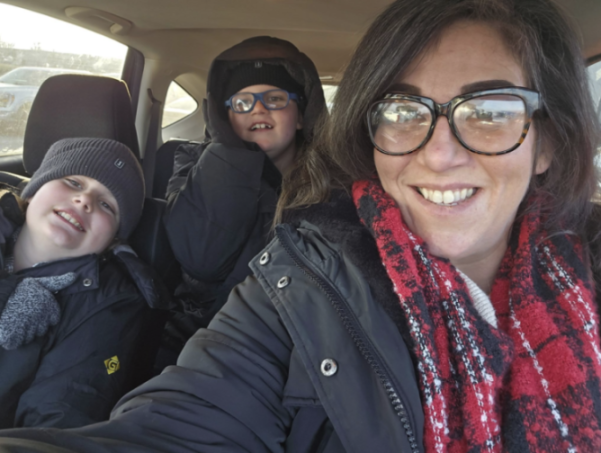Stephanie Bell, 40, with her two sons, Lukas, 10, and Liam, eight, inside a car.