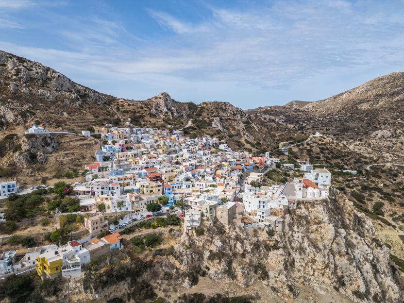 Aerial view of the colourful hilltop town of Menetes in Karpathos, Greece.