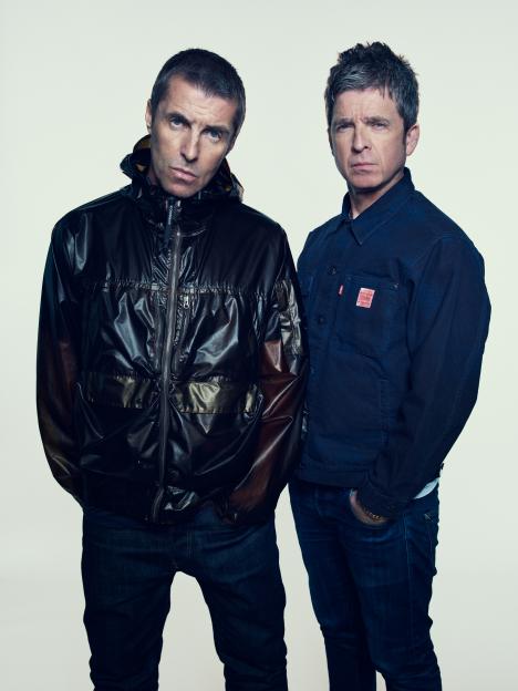 Liam and Noel Gallagher posing for the Oasis Live 2025 tour announcement.