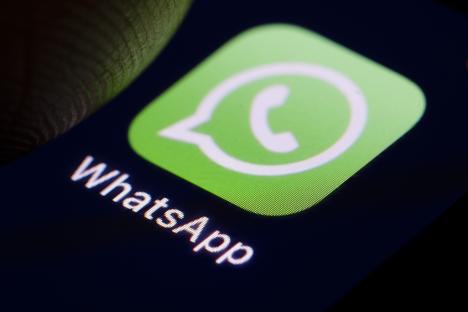 WhatsApp logo on a smartphone screen.