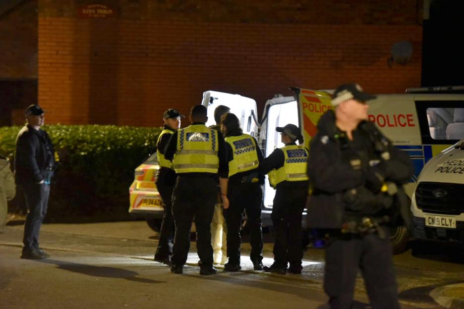 Police officers at a crime scene.