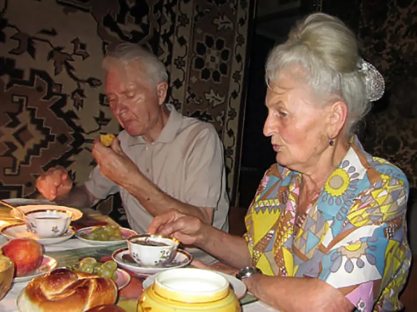 Elderly couple enjoying a meal together.