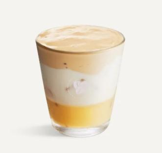 White chocolate iced whipped latte in a glass.