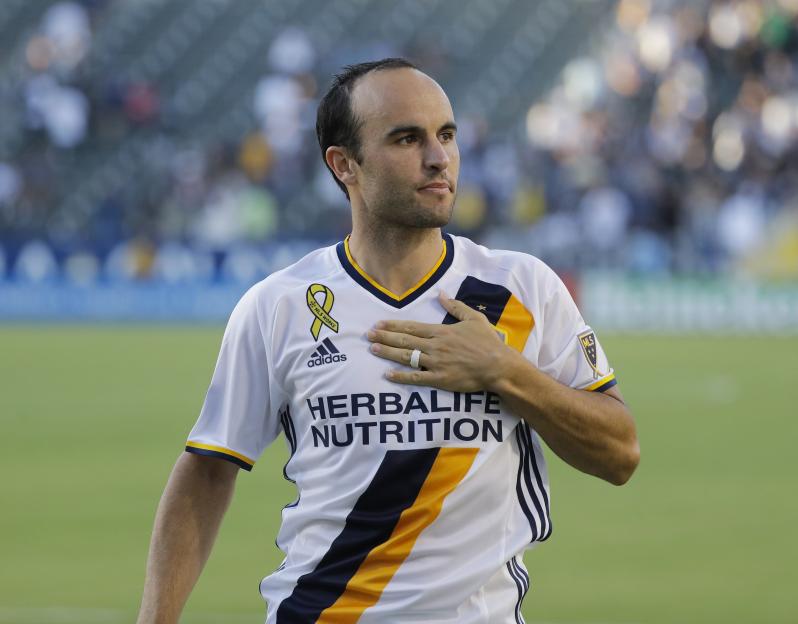 Landon Donovan with his hand over his heart in his Los Angeles Galaxy jersey.