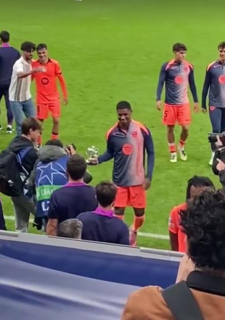 Marcus Rashford collecting Man of the Match award after Newcastle clash.