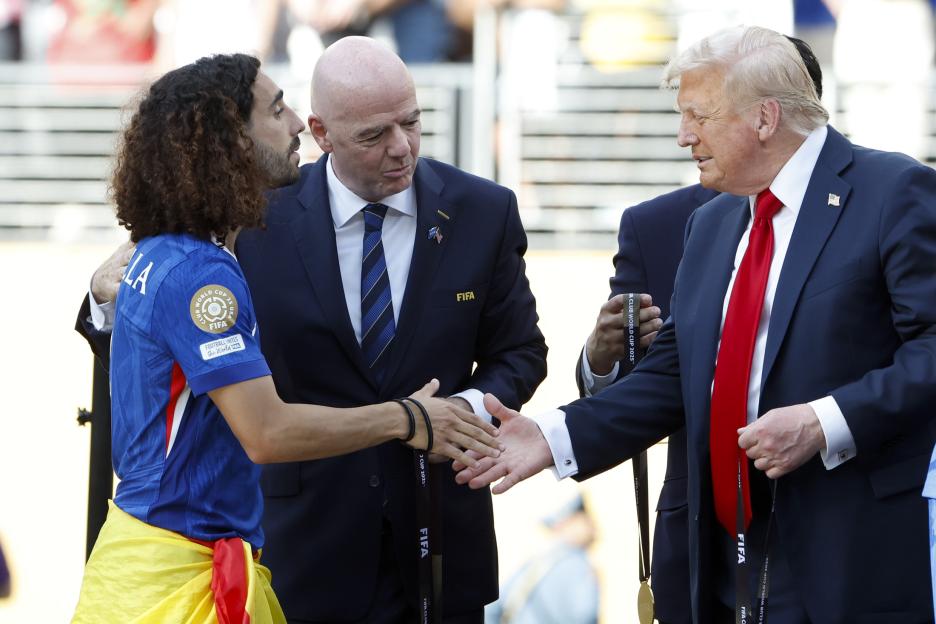 Marc Cucurella, FIFA President Gianni Infantino, and Donald Trump at a trophy ceremony.