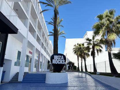 Ibiza Rocks Hotel entrance with palm trees.