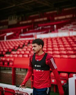 Morgan Gibbs-White training in a stadium.