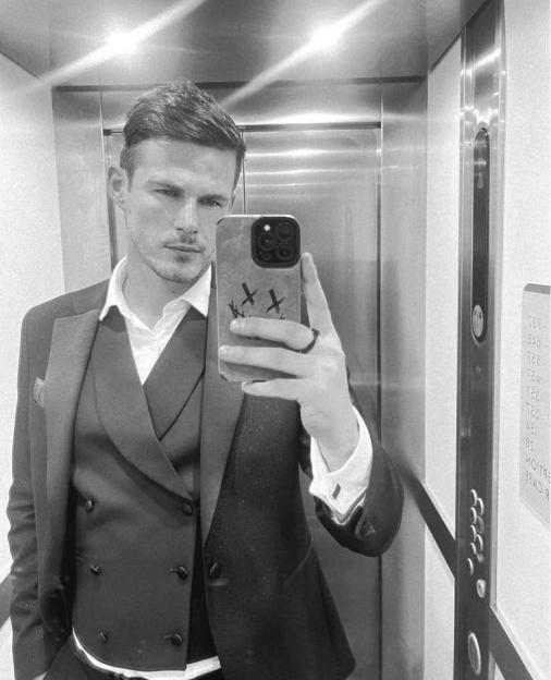 Black and white selfie of Steven Springett in a suit.