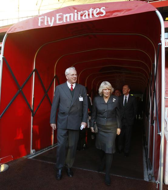 The Duchess of Cornwall and Sir Chips Keswick leaving a tunnel at the Emirates Stadium.
