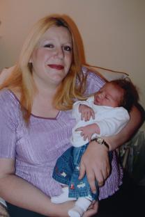 Woman holding a baby.