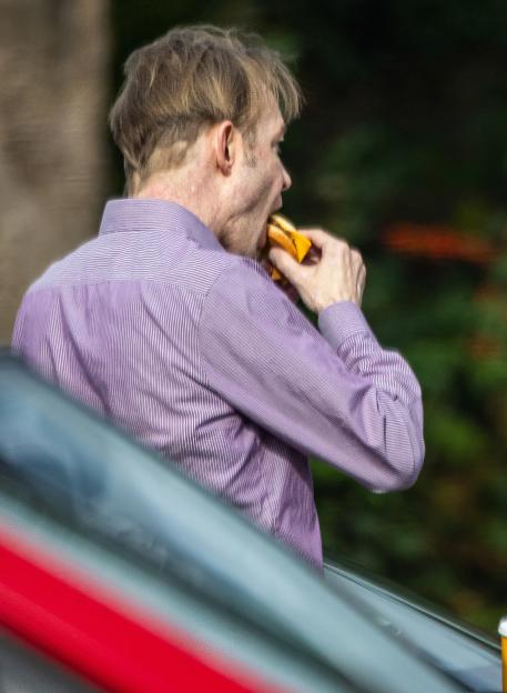 Christian Brueckner eating a hamburger at McDonald's in Buchholz in der Nordheide.