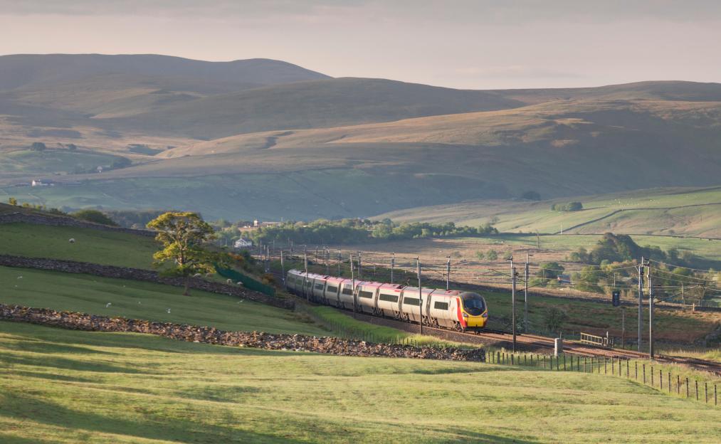Virgin Trains class 390 Pendolino train passing Shap Wells, Cumbria with the 04:28 Glasgow Central - London Euston.