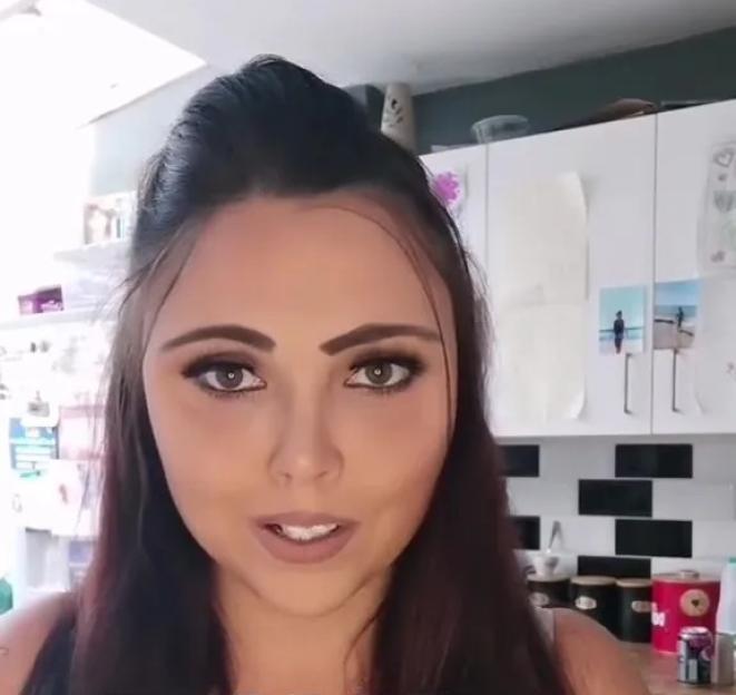 Woman expressing thanks in a video.