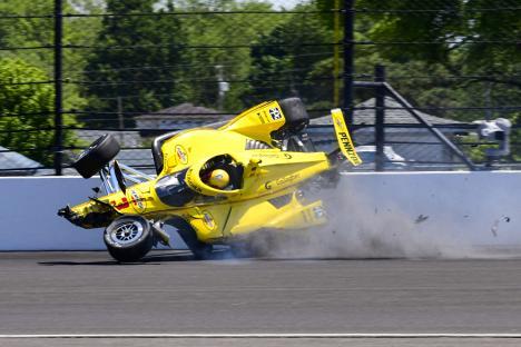 Race car crashing into a wall.