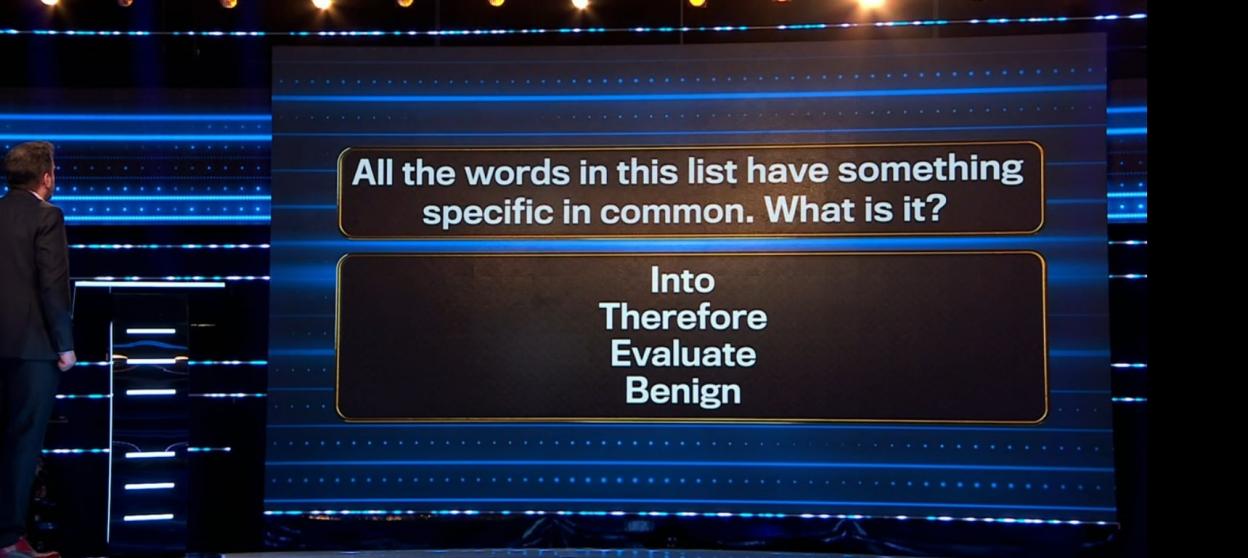 Screenshot of a game show question: "All the words in this list have something specific in common. What is it?"  The words are: Into, Therefore, Evaluate, Benign.