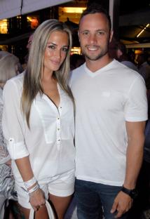 Couple in white shirts at an event.