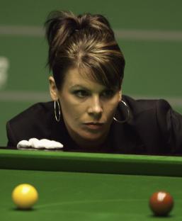 Referee Michaela Tabb watches snooker balls during a match.