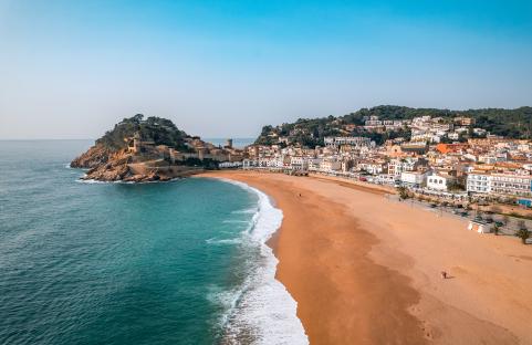 Aerial view of Platja Gran beach in Costa Brava, Spain.