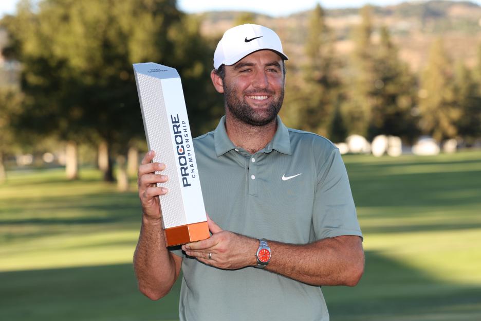 Scottie Scheffler holding the Procore Championship trophy.