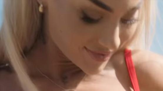 Alisha Lehmann risks wardrobe malfunction as she adjusts bra while modelling bikini