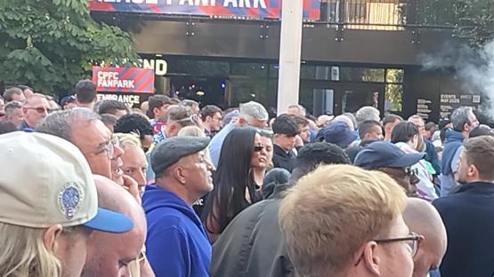 Maya Jama in a crowd of people leaving Wembley Stadium.
