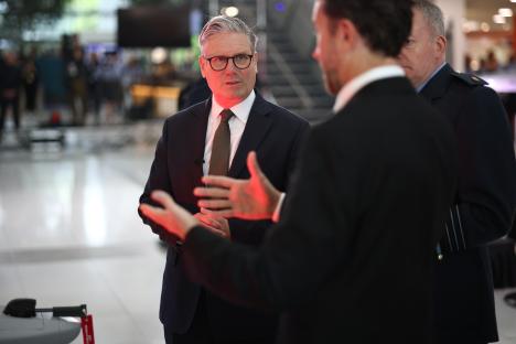UK Prime Minister Keir Starmer speaking with staff.