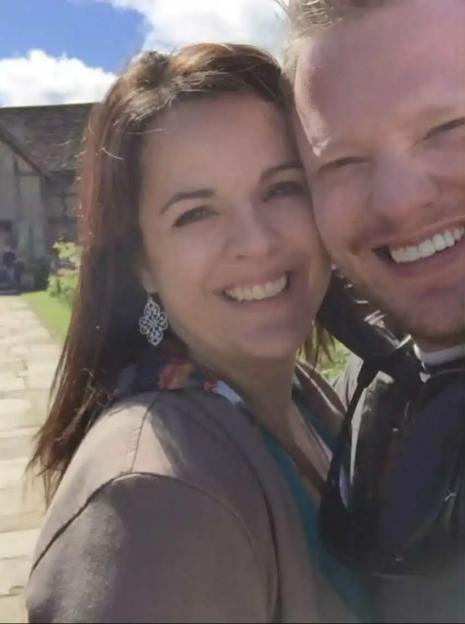 Angela Craig and James Craig smiling in a selfie outdoors.