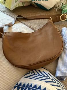 Brown half-moon handbag.