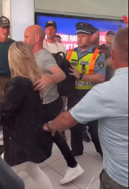 Anthony Taylor being apprehended by police.