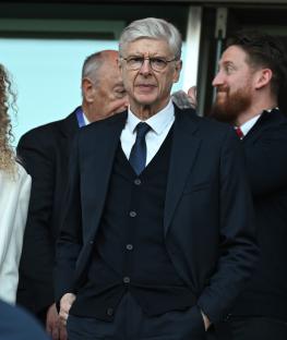 Arsene Wenger in the directors box at an Arsenal FC game.