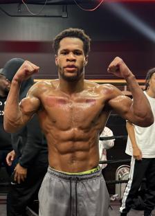 Devin Haney flexing his muscles.