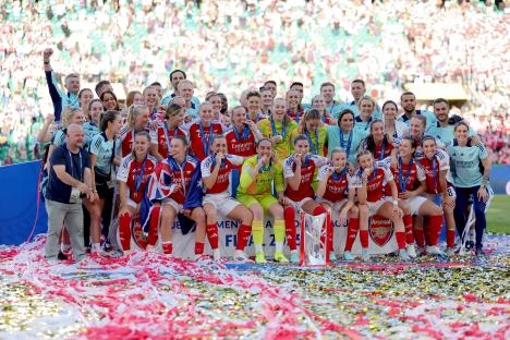 Arsenal women's football team celebrates their UEFA Women's Champions League victory.