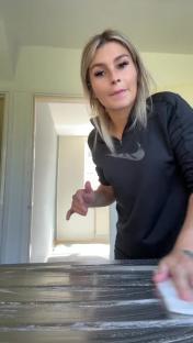 Woman cleaning a countertop.