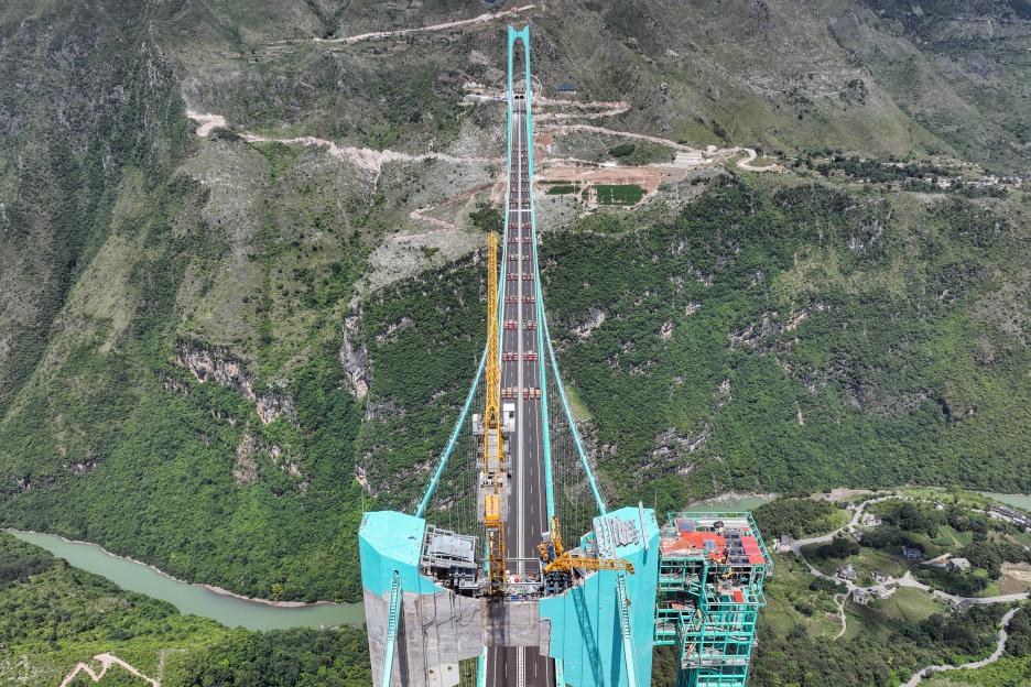 Aerial view of the Huajiang Grand Canyon Bridge in China undergoing a load test.