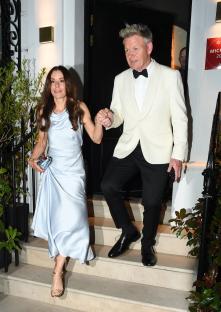 Gordon and Tanya Ramsay leaving a restaurant.
