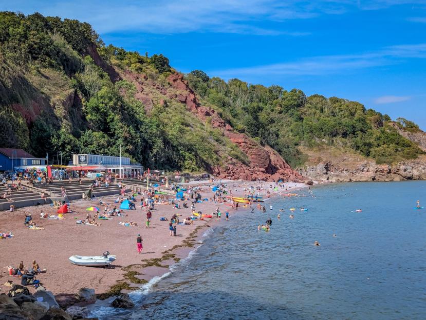 Crowded beach at Oddicombe in Torquay on a hot day.