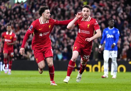 Liverpool's Diogo Jota and Curtis Jones celebrating a goal.