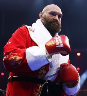 Tyson Fury in boxing robe and gloves.
