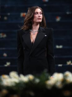 Hailey Bieber at the Met Gala in a black tuxedo.