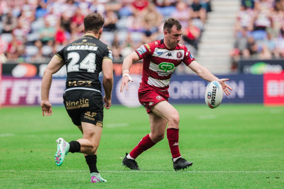 Rugby player running with the ball.