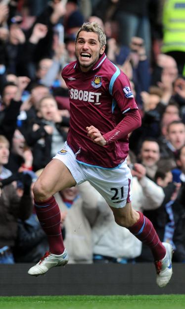 Valon Behrami celebrating a goal for West Ham United.