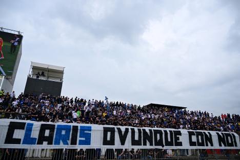 Atalanta fans holding a banner that reads
