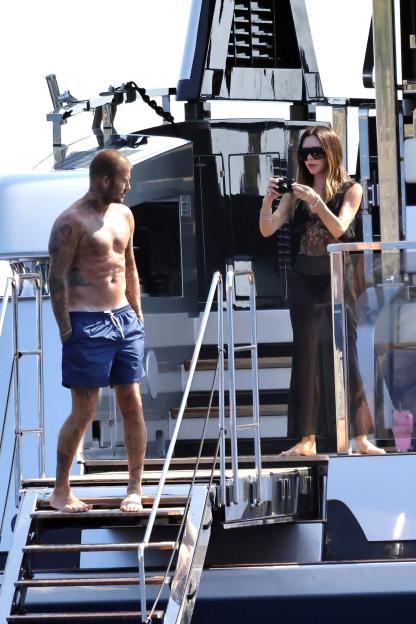 David and Victoria Beckham on a yacht.