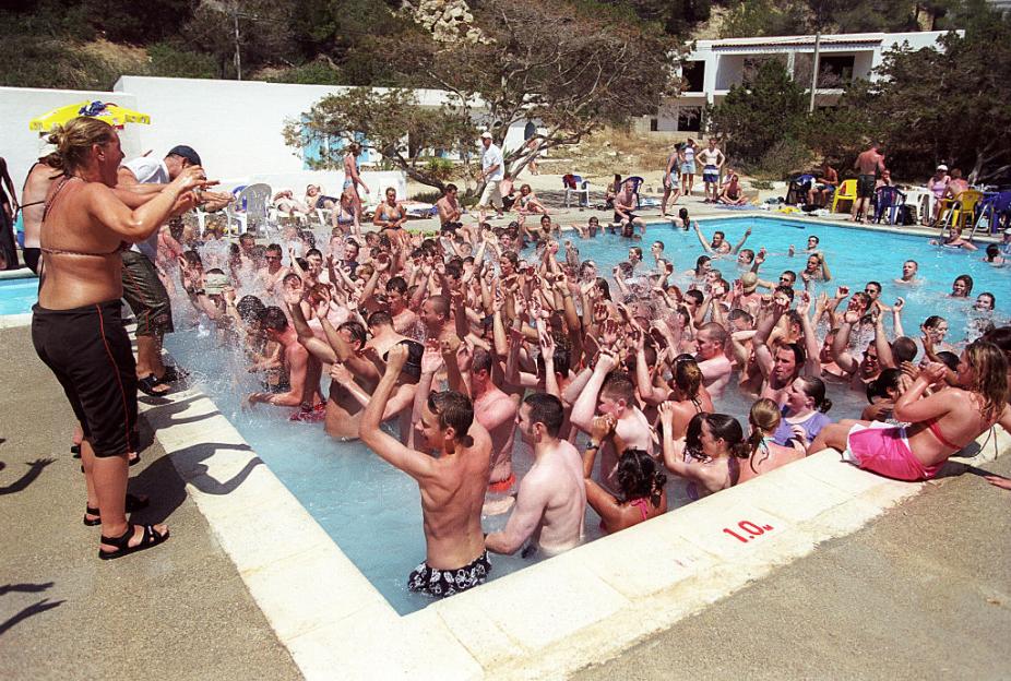 Large group of young people at a pool party.
