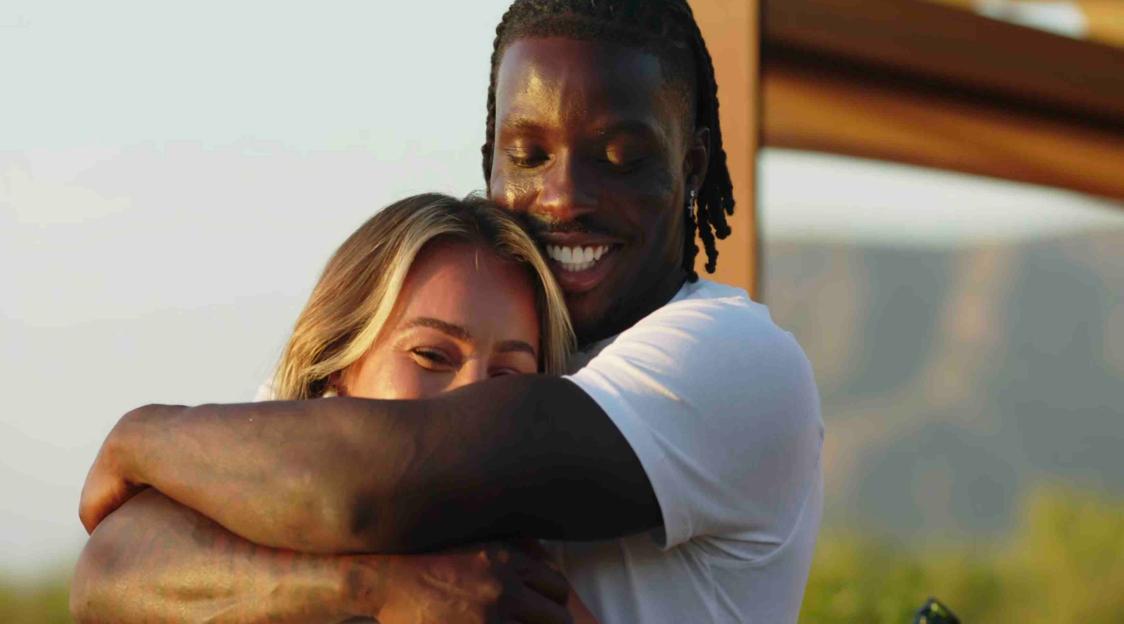 A man and woman embracing.